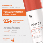 A white bottle with an orange cap for "REVITA HIGH-PERFORMANCE HAIR DENSITY SHAMPOO" and text in Spanish.