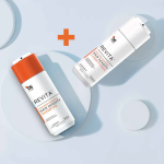 Two white bottles, one "REVITA HIGH-PERFORMANCE HAIR DENSITY SHAMPOO" and one conditioner, on a light blue background.